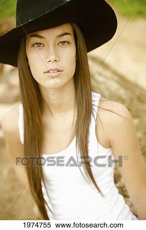 Stock Photography - Hawaii, Kauai, Gillin's Beach, Portrait Of A Cowgirl.. Fotosearch