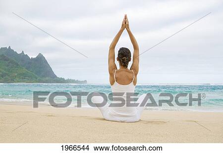 Hawaii, Kauai, Haena Beach Tunnels Beach, Woman Meditating On Sandy Shore. View Large Photo Image Picture - Hawaii, Kauai, Haena Beach Tunnels Beach, Woman Meditating On Sandy Shore.. Fotosearch