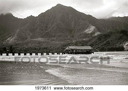Stock Image - Hawaii, Kauai, Hanalei Bay And Pier At Sunset, Black And White.. Fotosearch