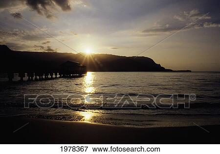 Stock Photo - Hawaii, Kauai, Hanalei Bay, Sunset Over The Pier.. Fotosearch