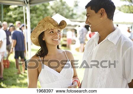 Stock Photo - Hawaii, Kauai, Hanalei Bay, Waipa's Farmers Market, Young Couple Shopping At The Local Farmers Market.. Fotosearch