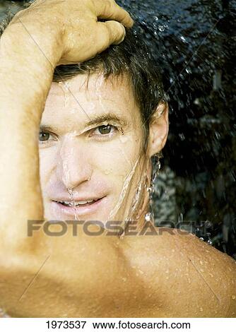 Hawaii, Kauai, Hanalei Bay, Young Man At The Beach Showering After A Day Of Surfing. View Large Photo Image Stock Photo - Hawaii, Kauai, Hanalei Bay, Young Man At The Beach Showering After A Day Of Surfing.. Fotosearch