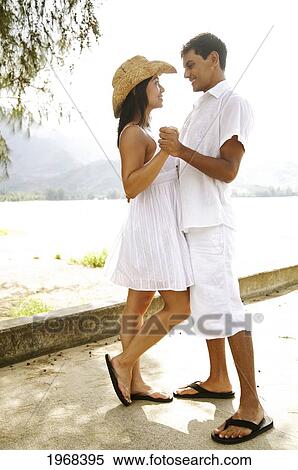 Hawaii, Kauai, Hanalei Bay, Young Couple Holding Eachother On The Peir. View Large Photo Image Stock Photography - Hawaii, Kauai, Hanalei Bay, Young Couple Holding Eachother On The Peir.. Fotosearch