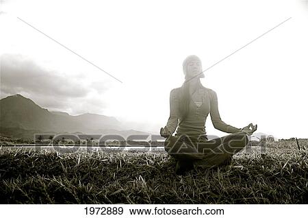Stock Photo - Hawaii, Kauai, Hanalei, Beautiful Fashion Model 0N A Grassy Field.. Fotosearch