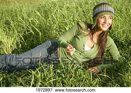 Hawaii, Kauai, Hanalei, Beautiful Fashion Model 0N A Grassy Field. View Large Photo Image Stock Photo - Hawaii, Kauai, Hanalei, Beautiful Fashion Model 0N A Grassy Field.. Fotosearch