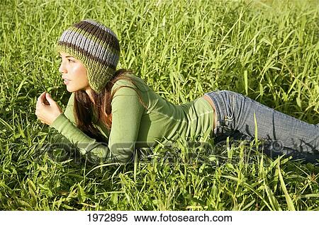 Hawaii, Kauai, Hanalei, Beautiful Fashion Model 0N A Grassy Field. View Large Photo Image Stock Photography - Hawaii, Kauai, Hanalei, Beautiful Fashion Model 0N A Grassy Field.. Fotosearch