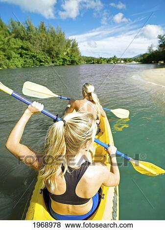 Hawaii, Kauai, Hanalei River, Two Active Young Woman Paddling In Hanalei River. View Large Photo Image Stock Photo - Hawaii, Kauai, Hanalei River, Two Active Young Woman Paddling In Hanalei River.. Fotosearch
