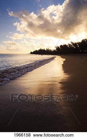 Hawaii, Kauai, Hanalei, Sunrise At Haena Beach Tunnels Beach, Golden Reflections On Sand. View Large Photo Image Stock Photo - Hawaii, Kauai, Hanalei, Sunrise At Haena Beach Tunnels Beach, Golden Reflections On Sand.. Fotosearch