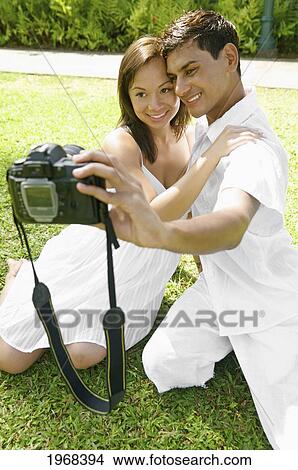 Picture - Hawaii, Kauai, Hanalei, Young Couple Posing For The Camera.. Fotosearch