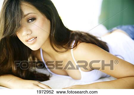 Stock Image - Hawaii, Kauai, Headshot Of Attractive Young Woman.. Fotosearch