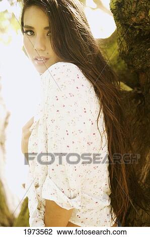 Stock Image - Hawaii, Kauai, Headshot Of Attractive Young Woman.. Fotosearch