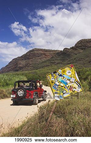 Hawaii, Kauai, Jeep On Road To Polihale Beach Park And Sign Covered With Surfing Decals View Large Photo Image Stock Photography - Hawaii, Kauai, Jeep On Road To Polihale Beach Park And Sign Covered With Surfing Decals. Fotosearch