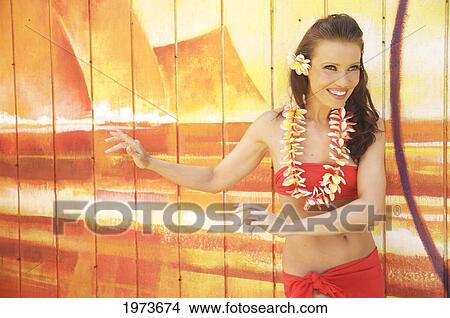 Picture - Hawaii, Kauai, Kapaa, Beautiful Woman Dancing Hula On A Beautiful Painted Backdrop Of A Beach.. Fotosearch