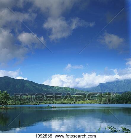 Stock Photo - Hawaii, Kauai, Kauaihai Ridge, Couple In Canoe On Calm Lake.. Fotosearch