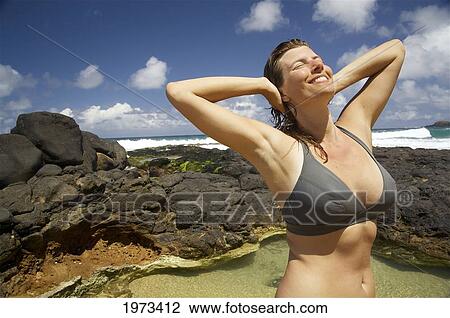 Hawaii, Kauai, Kauapea Beach (Secret Beach) Beautiful Woman In The Water. View Large Photo Image Stock Image - Hawaii, Kauai, Kauapea Beach (Secret Beach) Beautiful Woman In The Water.. Fotosearch