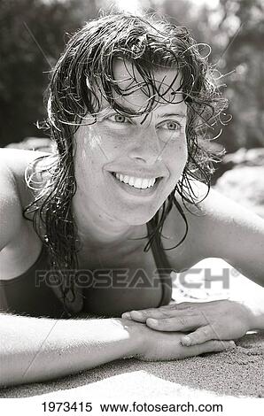 Hawaii, Kauai, Kauapea Beach (Secret Beach) Beautiful Woman On The Sand, Black And White. View Large Photo Image Stock Photography - Hawaii, Kauai, Kauapea Beach (Secret Beach) Beautiful Woman On The Sand, Black And White.. Fotosearch