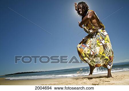 Picture - Hawaii, Kauai, Kealia Beach, African Dancer On Sandy Shore.. Fotosearch
