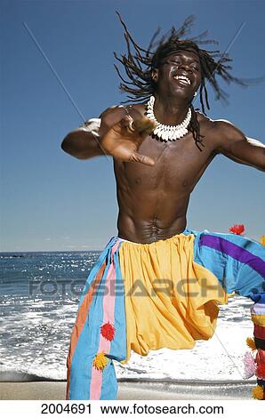 Hawaii, Kauai, Kealia Beach, African Dancer On Sandy Shore. View Large Photo Image Stock Image - Hawaii, Kauai, Kealia Beach, African Dancer On Sandy Shore.. Fotosearch