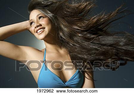 Stock Image - Hawaii, Kauai, Kealia Beach, Attractive Young Woman On The Beach.. Fotosearch