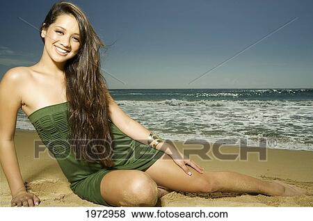 Stock Photo - Hawaii, Kauai, Kealia Beach, Attractive Young Woman On The Beach.. Fotosearch