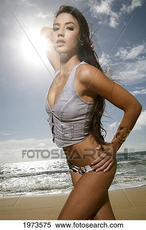 Stock Photography - Hawaii, Kauai, Kealia Beach, Attractive Young Woman On The Beach.. Fotosearch