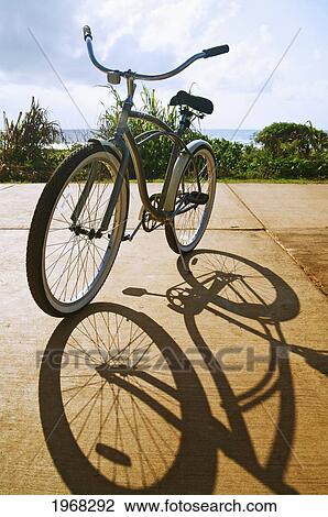 Hawaii, Kauai, Kealia Beach, Bike Parked On Bike Path, Beautiful Shadow. View Large Photo Image Stock Image - Hawaii, Kauai, Kealia Beach, Bike Parked On Bike Path, Beautiful Shadow.. Fotosearch