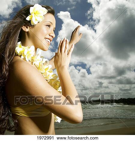 Hawaii, Kauai, Kealia, Beautiful Hawaiian Girl Dancing Hula On Ocean Shoreline. View Large Photo Image Stock Image - Hawaii, Kauai, Kealia, Beautiful Hawaiian Girl Dancing Hula On Ocean Shoreline.. Fotosearch
