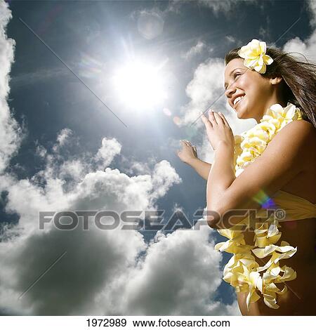 Stock Photo - Hawaii, Kauai, Kealia, Beautiful Hawaiian Girl Dancing Hula On Ocean Shoreline.. Fotosearch