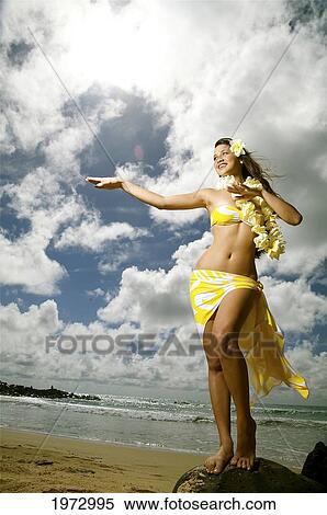 Hawaii, Kauai, Kealia, Beautiful Hawaiian Girl Dancing Hula On Ocean Shoreline. View Large Photo Image Stock Photography - Hawaii, Kauai, Kealia, Beautiful Hawaiian Girl Dancing Hula On Ocean Shoreline.. Fotosearch