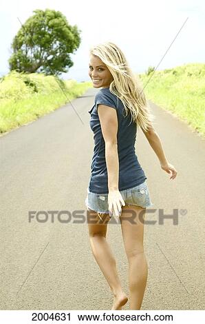 Hawaii, Kauai, Kealia, Young Attractive Blonde Woman Walks Barefoot Along Path, Looking Back. View Large Photo Image Stock Image - Hawaii, Kauai, Kealia, Young Attractive Blonde Woman Walks Barefoot Along Path, Looking Back.. Fotosearch