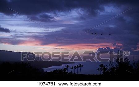 Stock Image - Hawaii, Kauai, Kilauea, Sunsetting Over The North Shore.. Fotosearch