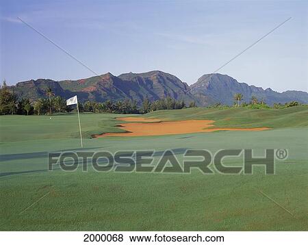 Stock Photo - Hawaii, Kauai, Lagoons Kiele Course 10Th Hole Landscaped Grounds, Mountains Background Afternoon Shadow. Fotosearch