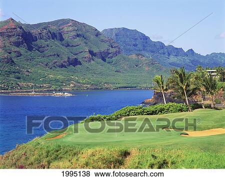 Hawaii, Kauai, Lihue, Kauai Lagoons Golf Course, Kiele Course, Ocean And Mountains. View Large Photo Image Stock Photo - Hawaii, Kauai, Lihue, Kauai Lagoons Golf Course, Kiele Course, Ocean And Mountains.. Fotosearch