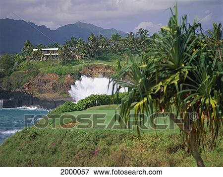 Hawaii, Kauai, Lihue, Kauai Lagoons Resort, Kiele Golf Course, Hole Along Coast Large Wave Crash Clubhouse Background View Large Photo Image Stock Photo - Hawaii, Kauai, Lihue, Kauai Lagoons Resort, Kiele Golf Course, Hole Along Coast Large Wave Crash Clubhouse Background. Fotosearch