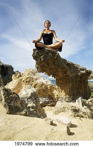 Hawaii, Kauai, Mahaulepu, Woman Doing Yoga. View Large Photo Image Stock Photo - Hawaii, Kauai, Mahaulepu, Woman Doing Yoga.. Fotosearch