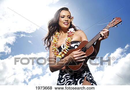 Hawaii, Kauai, Menehune Pond, Beautiful Woman Playing The Ukulele. View Large Photo Image Stock Photo - Hawaii, Kauai, Menehune Pond, Beautiful Woman Playing The Ukulele.. Fotosearch