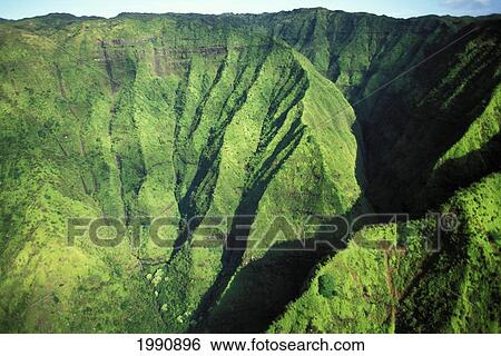 Stock Photograph - Hawaii, Kauai, Mt. Waialeale, Lush Aerial View Of Mountain Ridges. Fotosearch