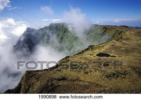 Hawaii, Kauai, Mt. Waialeale, Mountain Peak With Light Clouds Cresting Over Ridge. View Large Photo Image Stock Photo - Hawaii, Kauai, Mt. Waialeale, Mountain Peak With Light Clouds Cresting Over Ridge.. Fotosearch