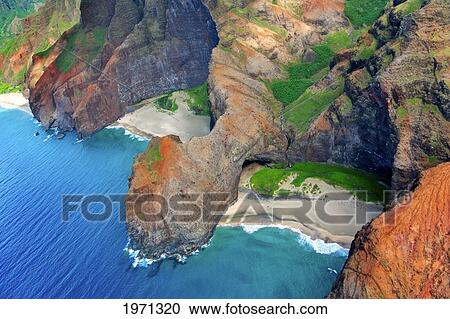 Stock Image - Hawaii, Kauai, Na Pali Coast, Aerial Of Coastal Cliffs And Honopu Beach (Or Cathedral Beach).. Fotosearch
