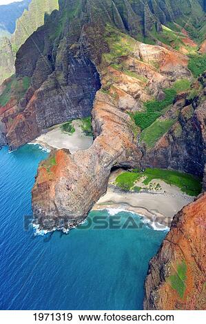 Hawaii, Kauai, Na Pali Coast, Aerial Of Coastal Cliffs And Honopu Beach (Or Cathedral Beach). View Large Photo Image Stock Photo - Hawaii, Kauai, Na Pali Coast, Aerial Of Coastal Cliffs And Honopu Beach (Or Cathedral Beach).. Fotosearch