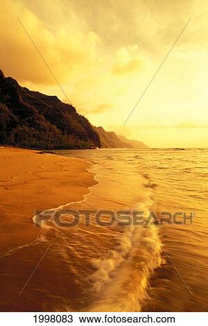 Hawaii, Kauai, Na Pali Coast, Beach At Sunset, With Foamy Surf And Cliff In Background. View Large Photo Image Stock Image - Hawaii, Kauai, Na Pali Coast, Beach At Sunset, With Foamy Surf And Cliff In Background.. Fotosearch