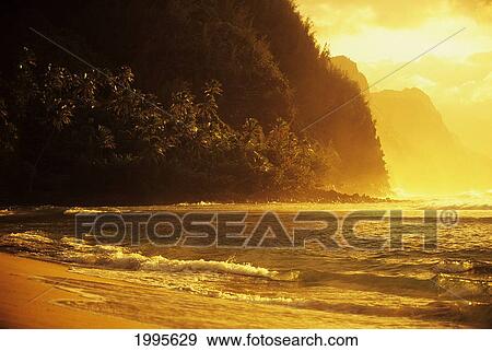 Hawaii, Kauai, Na Pali Coast, Beach At Sunset, Golden Orange Reflections View Large Photo Image Stock Photo - Hawaii, Kauai, Na Pali Coast, Beach At Sunset, Golden Orange Reflections. Fotosearch