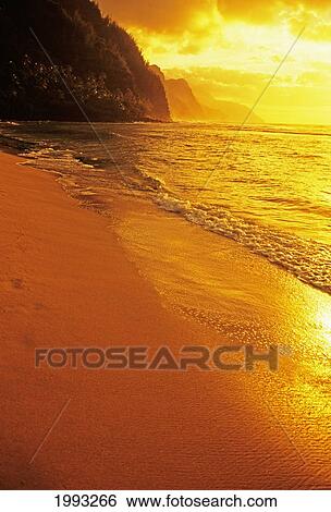 Hawaii, Kauai, Na Pali Coast, Beach At Sunset, Golden Orange Reflections View Large Photo Image Stock Photograph - Hawaii, Kauai, Na Pali Coast, Beach At Sunset, Golden Orange Reflections. Fotosearch