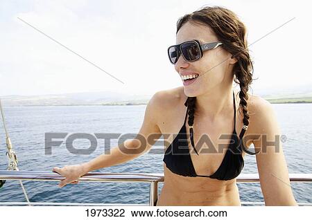 Stock Image - Hawaii, Kauai, Na Pali Coast, Beautiful Tourist Enjoying A Day Out On A Boat.. Fotosearch
