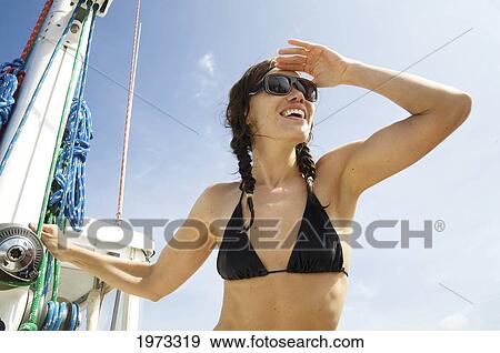 Hawaii, Kauai, Na Pali Coast, Beautiful Tourist Enjoying A Day Out On A Boat. View Large Photo Image Stock Photo - Hawaii, Kauai, Na Pali Coast, Beautiful Tourist Enjoying A Day Out On A Boat.. Fotosearch