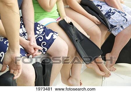 Stock Image - Hawaii, Kauai, Na Pali Coast, Group Of Tourist Getting Ready To Dive.. Fotosearch