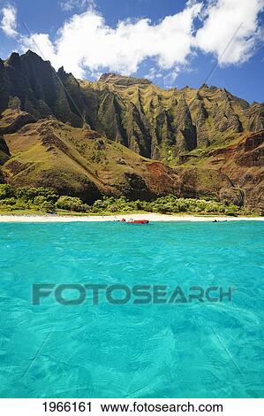 Stock Image - Hawaii, Kauai, Na Pali Coast, Kalalau Beach And Cliffs In Background, View From Ocean.. Fotosearch
