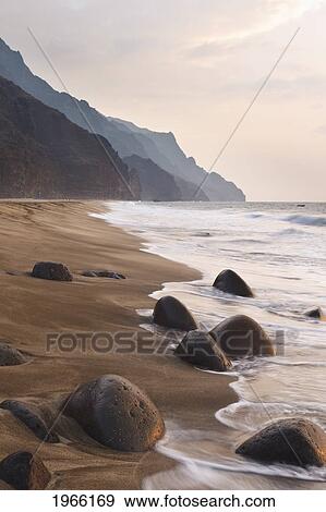 Stock Photo - Hawaii, Kauai, Na Pali Coast, Sunset Over Kalalau Beach And Cliffs Beyond.. Fotosearch
