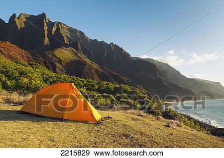 Stock Photo - Hawaii, Kauai, Na Pali Coast, View of the Kalalau Mountains, Campisite and tent.. Fotosearch
