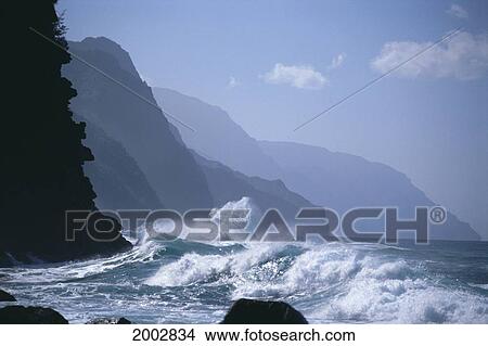 Picture - Hawaii, Kauai, Na Pali Coast, Waves Crash Against Rugged Coastline. Fotosearch
